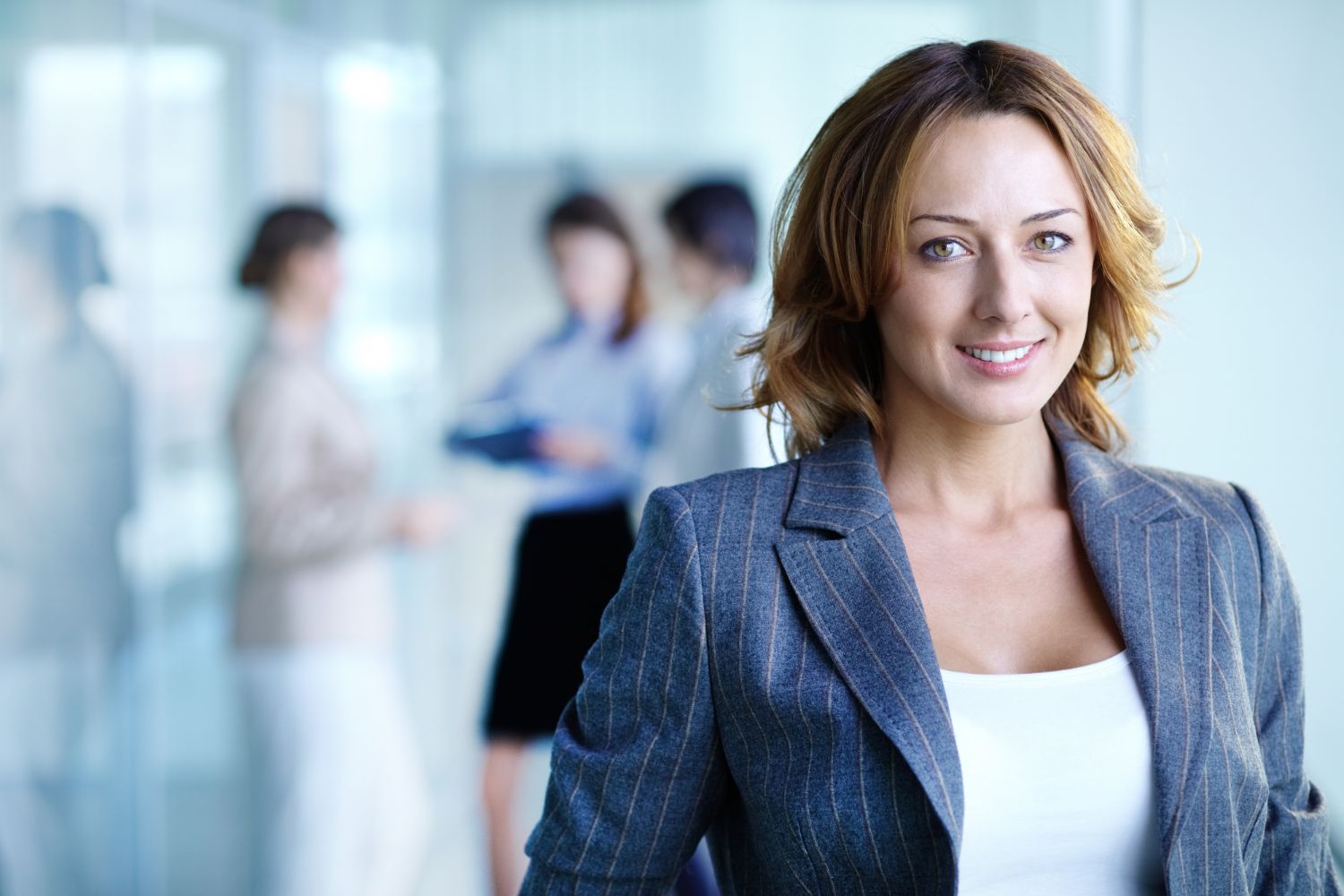 Woman in grey suit smiling at international engineering jobs recruitment agency