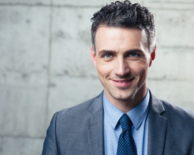 Smiling Italian Professional Engineering in grey suit